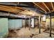 Unfinished basement with water heater and exposed utilities at 1120 Lexington Ave, Indianapolis, IN 46203