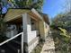 Yellow bungalow with side porch and walkway at 3221 E 38Th St, Indianapolis, IN 46218