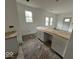 New kitchen with butcher block countertops and white cabinets, under renovation at 3221 E 38Th St, Indianapolis, IN 46218