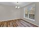 Bright dining room with hardwood floors and large window at 9562 N Gasburg Rd, Mooresville, IN 46158