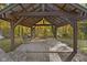 Relaxing pergola with brick patio, fire pit, and bench at 9562 N Gasburg Rd, Mooresville, IN 46158