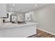 Modern kitchen with white cabinets and quartz countertops at 9562 N Gasburg Rd, Mooresville, IN 46158