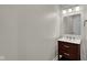 Small bathroom with dark vanity, white countertop and modern fixtures at 9562 N Gasburg Rd, Mooresville, IN 46158