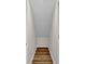 Small closet with sloped ceiling and wood flooring at 9562 N Gasburg Rd, Mooresville, IN 46158