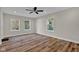 Bright bedroom with wood-look floors and ceiling fan at 9562 N Gasburg Rd, Mooresville, IN 46158