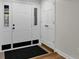Bright entryway with white doors and black mat at 9562 N Gasburg Rd, Mooresville, IN 46158