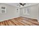 Bright bedroom with hardwood floors and multiple windows at 9562 N Gasburg Rd, Mooresville, IN 46158