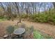 Small backyard patio with metal table and chairs at 5346 Shefford Ct, Indianapolis, IN 46254
