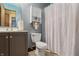 Clean bathroom with a shower/tub combo, vanity, and linen cabinet at 5346 Shefford Ct, Indianapolis, IN 46254