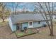 Back exterior view of light blue house with gray roof at 5346 Shefford Ct, Indianapolis, IN 46254
