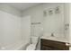 Updated bathroom with white subway tile and dark wood vanity at 1624 Bacon St, Indianapolis, IN 46237