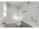 Modern bathroom with white subway tile, quartz vanity, and updated fixtures at 1624 Bacon St, Indianapolis, IN 46237