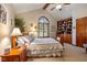 Cozy bedroom with a built-in bookcase and vaulted ceiling at 1079 Old Eagle Way, Greenwood, IN 46143