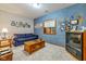 Finished basement Gathering room featuring a comfortable sofa and wall decor at 1079 Old Eagle Way, Greenwood, IN 46143