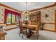Elegant formal dining room featuring a wood table, chairs, and built-in hutch at 1079 Old Eagle Way, Greenwood, IN 46143