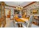 Formal dining room with floral wallpaper and chandelier at 1079 Old Eagle Way, Greenwood, IN 46143