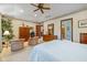 Main bedroom with two armchairs and large ceiling fan at 1079 Old Eagle Way, Greenwood, IN 46143