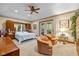 Spacious main bedroom with sitting area and access to a balcony at 1079 Old Eagle Way, Greenwood, IN 46143
