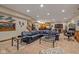 Finished basement with sectional sofa, large windows, and game area at 1079 Old Eagle Way, Greenwood, IN 46143