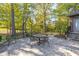 Stone patio with seating area, surrounded by lush landscaping at 1079 Old Eagle Way, Greenwood, IN 46143
