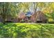 Brick ranch home with mature trees and landscaping at 1079 Old Eagle Way, Greenwood, IN 46143