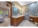 Double vanity bathroom with a large mirror and access to the bedroom at 1079 Old Eagle Way, Greenwood, IN 46143