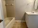 Bathroom with updated vanity and beige tile shower/tub combo at 4720 Stoughton Ct, Indianapolis, IN 46254