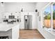 Modern kitchen with stainless steel appliances and white cabinets at 318 N Tacoma Ave, Indianapolis, IN 46201