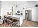 Modern kitchen with island, seating and stainless steel appliances at 318 N Tacoma Ave, Indianapolis, IN 46201
