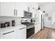 Modern kitchen featuring stainless steel appliances and white cabinetry at 318 N Tacoma Ave, Indianapolis, IN 46201