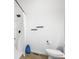 Simple bathroom with shower, toilet and white walls at 318 N Tacoma Ave, Indianapolis, IN 46201