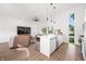 Modern kitchen with white cabinets, stainless steel appliances, and quartz countertops at 318 N Tacoma Ave, Indianapolis, IN 46201