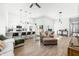 Open living space with hardwood floors, comfortable seating, and kitchen island at 318 N Tacoma Ave, Indianapolis, IN 46201