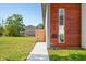 Modern home exterior with wood siding and landscaped lawn at 318 N Tacoma Ave, Indianapolis, IN 46201