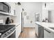 Modern kitchen with stainless steel appliances and white cabinets at 318 N Tacoma Ave, Indianapolis, IN 46201