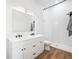Clean bathroom with white subway tile, double vanity, and walk-in shower at 318 N Tacoma Ave, Indianapolis, IN 46201