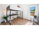 Bedroom with a loft bed, desk, and hardwood floors at 318 N Tacoma Ave, Indianapolis, IN 46201