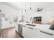 Open concept kitchen with white cabinets, quartz countertops, and island at 318 N Tacoma Ave, Indianapolis, IN 46201