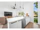Open concept kitchen with island seating and stainless steel appliances at 318 N Tacoma Ave, Indianapolis, IN 46201