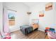 Bright bedroom with a twin bed, hardwood floors, and a large window at 318 N Tacoma Ave, Indianapolis, IN 46201