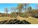Spacious backyard with lush green grass and mature trees at 3708 State Ferry Rd, Solsberry, IN 47459
