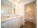 Bathroom with double vanity and a separate tub and shower at 5856 Sleighbell Dr, Greenwood, IN 46143