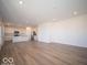 Open concept kitchen with island, stainless steel appliances and white cabinets at 5856 Sleighbell Dr, Greenwood, IN 46143