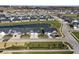 Aerial view of a community with houses and a pond at 802 Weldon Way, Westfield, IN 46074