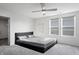 Bedroom with a black platform bed and ample closet space at 802 Weldon Way, Westfield, IN 46074