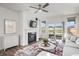 Living room with fireplace, water view, and access to patio at 802 Weldon Way, Westfield, IN 46074
