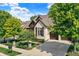 Beautiful home exterior with landscaping and driveway at 15571 Bridgewater Club Blvd, Carmel, IN 46033