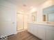 Bathroom with double vanity, marble countertop and shower at 6105 Card Blvd, Indianapolis, IN 46221