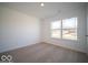 Spacious bedroom with neutral walls and carpet flooring at 6105 Card Blvd, Indianapolis, IN 46221