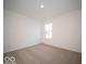 Bright bedroom with neutral walls and carpeted floor at 6105 Card Blvd, Indianapolis, IN 46221